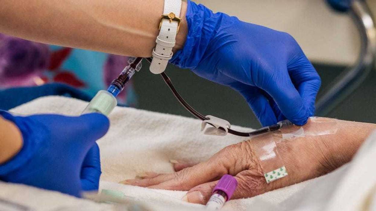 HOUSTON, TEXAS - AUGUST 18: An Emergency Room nurse tends to a patient at the Houston Methodist The Woodlands Hospital on August 18, 2021 in Houston, Texas.