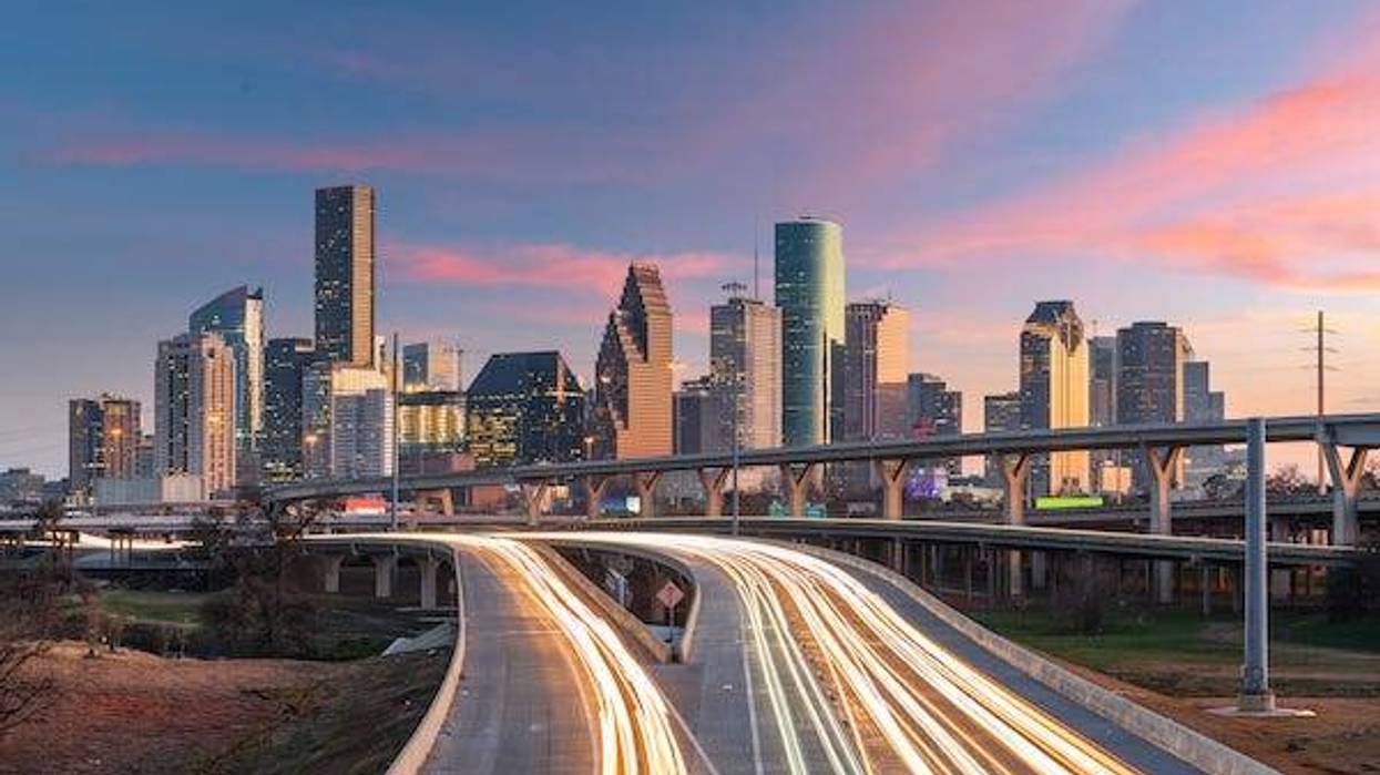 Houston, Texas skyline over the highways at dusk.