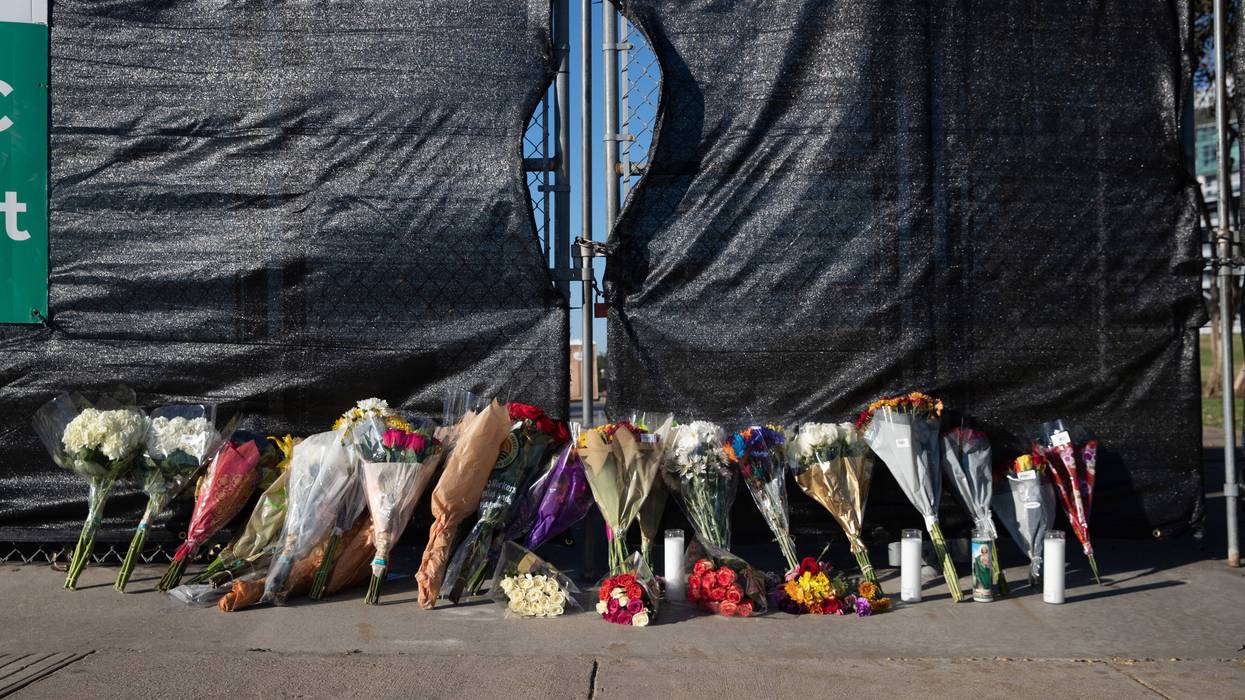 Houston, Texas, United States; Flowers are laid against a fence outside of NRG Park on Saturday, Nov. 6, 2021, to honor those who died at the Astroworld Festival in Houston, Texas.