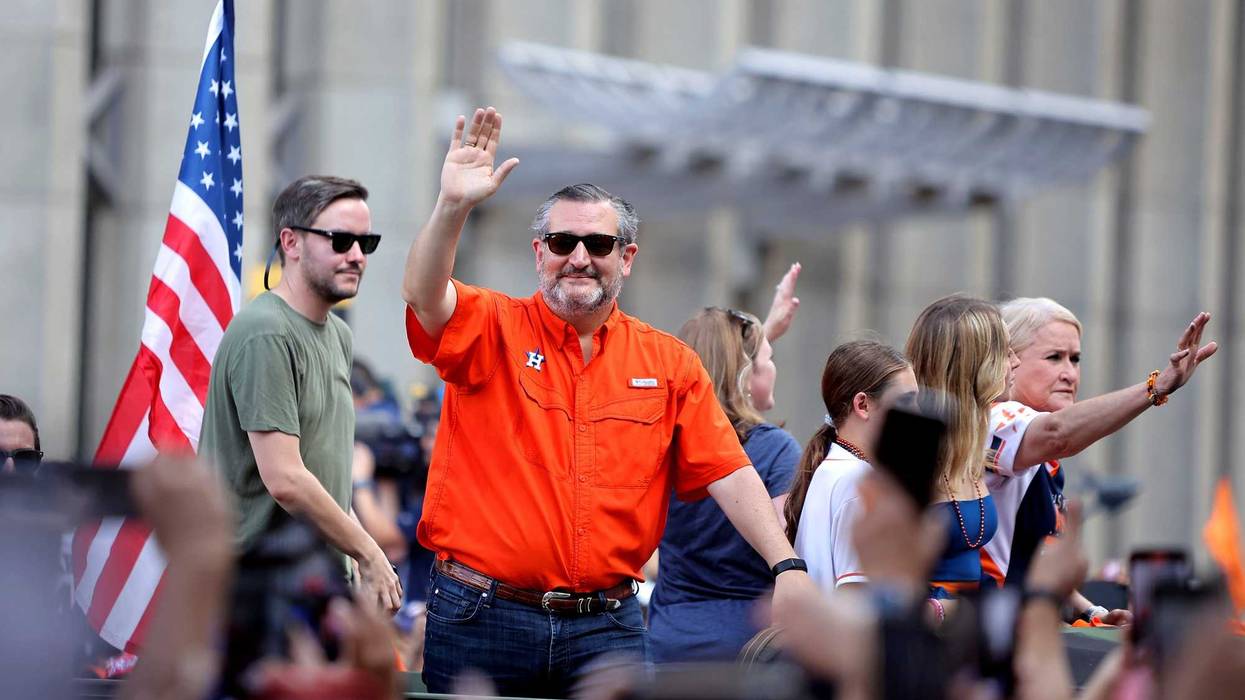 Houston, Texas, USA; State senator Ted Cruz (orange) waves to the crowd during the Houston Astros Championship Parade in Houston, TX. M