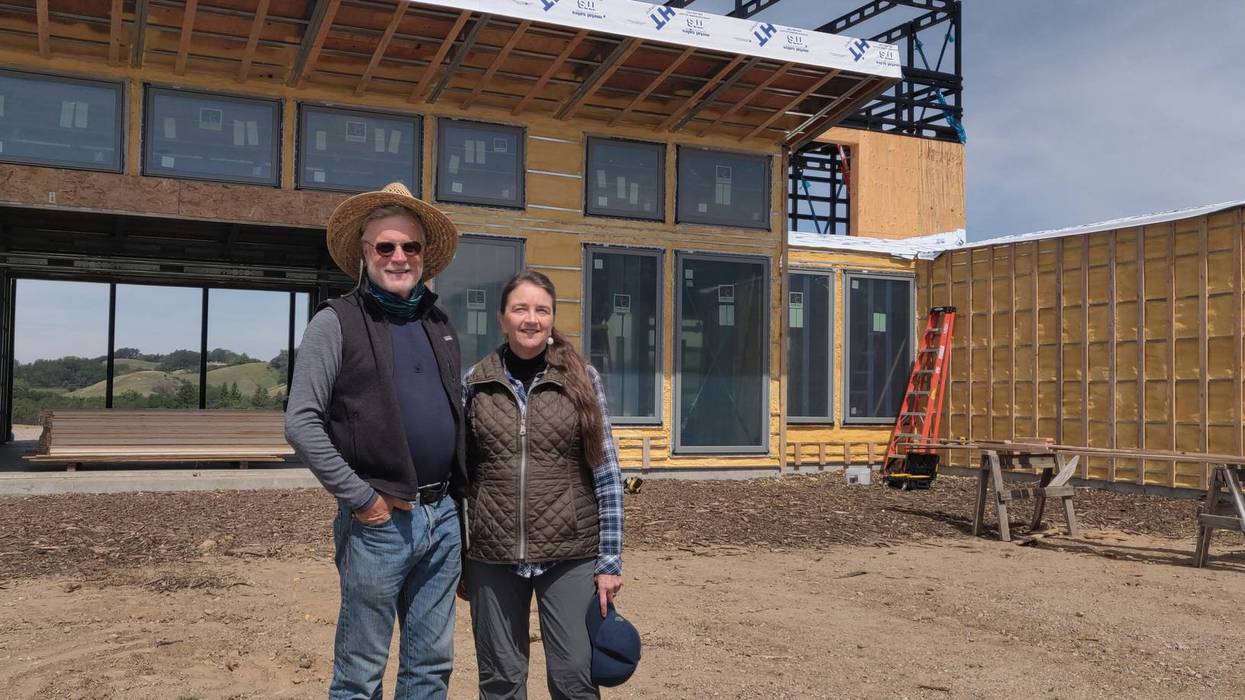 Howard and Merritt Booster stand in front of their new home being built in Santa Rosa where their previous house was destroyed by the 2017 Tubbs Fire.