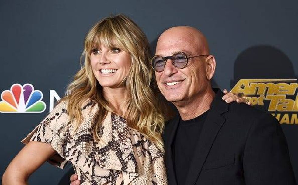 WATCH: Howie Mandel, 65, struts in thigh-high stiletto boots for Heidi Klum