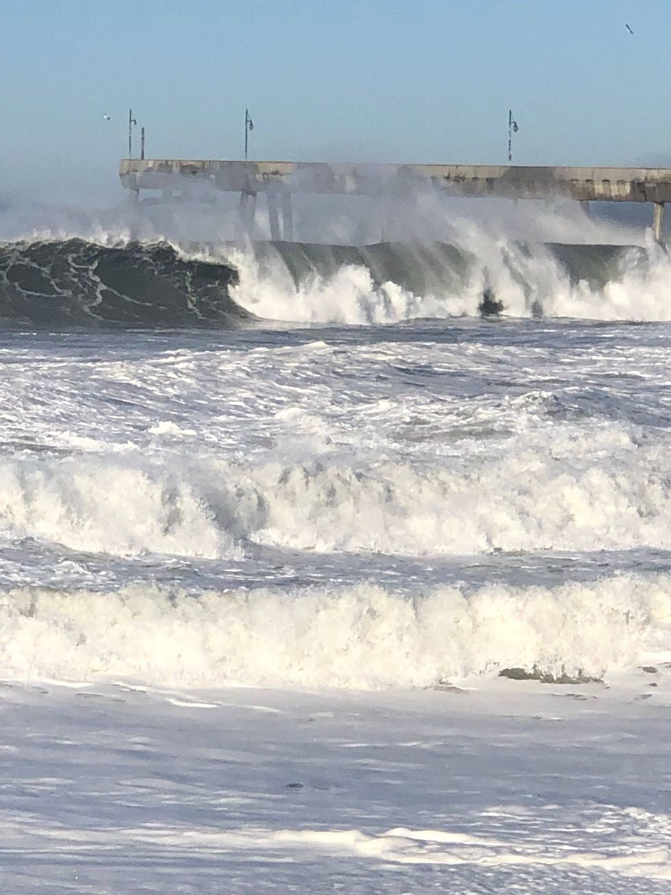 Huge waves crash on the beach Tuesday morning in Pacifica.