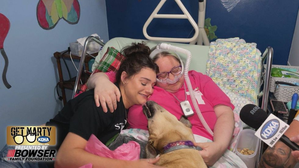 Hugs and licks after Sammie (right) tells Alex (left) that she