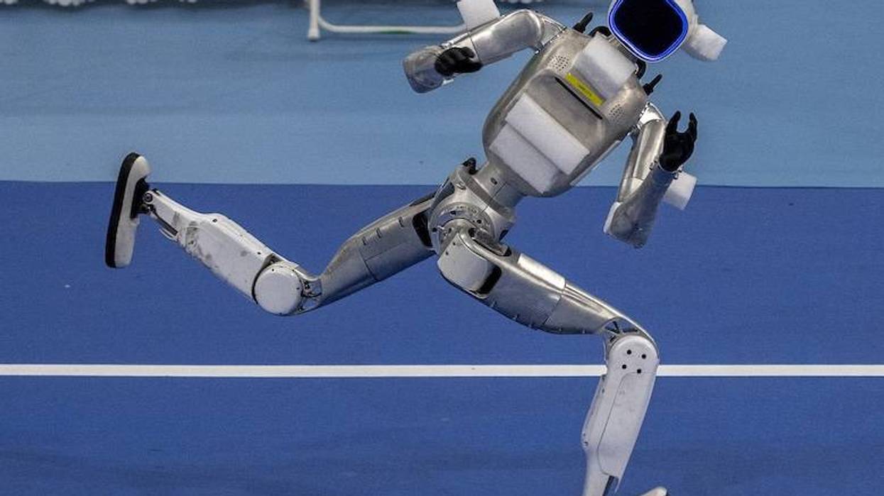 Humanoid robot sprinting on a track