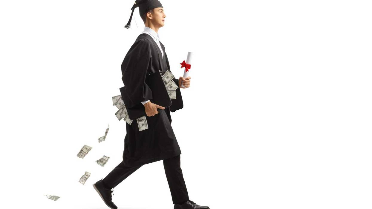 Hundred dollar bills wearing a graduation cap.