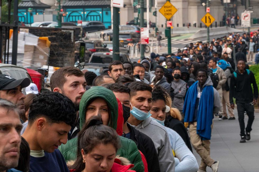 Hundreds of asylum seekers line up outside of the Jacob K. Javits Federal Building on June 6, 2023 in New York City