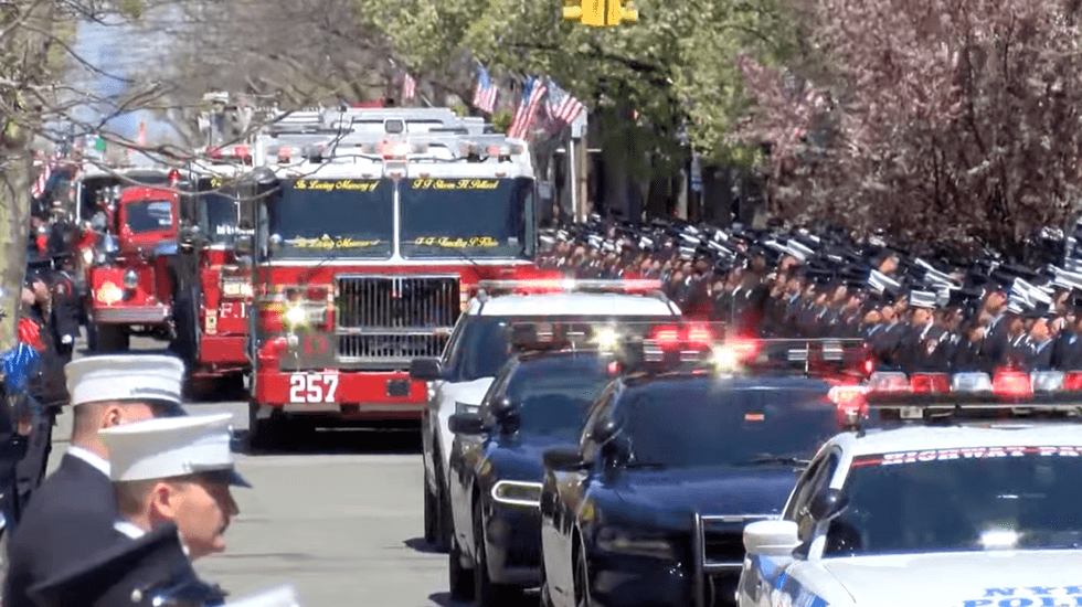 Hundreds of FDNY members lined the streets of Belle Harbor to pay their respects