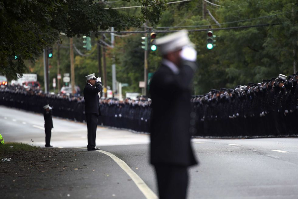 Hundreds of firefighters, EMS workers and other first responders gather at the Tilles Center for Performing Arts in in Brookville, New York, on Oct. 5, 2022