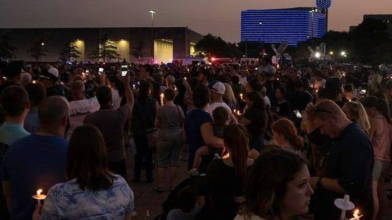 Hundreds of residents show support for the Dallas Police Department at the Dallas Strong Candlelight Vigil on July 11, 2016 in downtown Dallas, Texas. Texas. Five police officers were killed and seven others were injured in a shooting ambush during a marc
