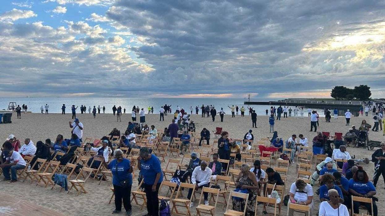 Hundreds or people attend a prayer event at Chicago's 31st Street Beach, which has recently been the site of multiple shootings.