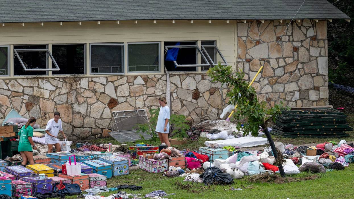 HUNT, TEXAS - JULY 07: People sift through children's belongings at Camp Mystic on July 07, 2025 in Hunt, Texas. Heavy rainfall caused severe flash flooding along the Guadalupe River in central Texas, leaving more than 90 people reported dead, including children attending the camp. (Photo by Brandon Bell/Getty Images)
