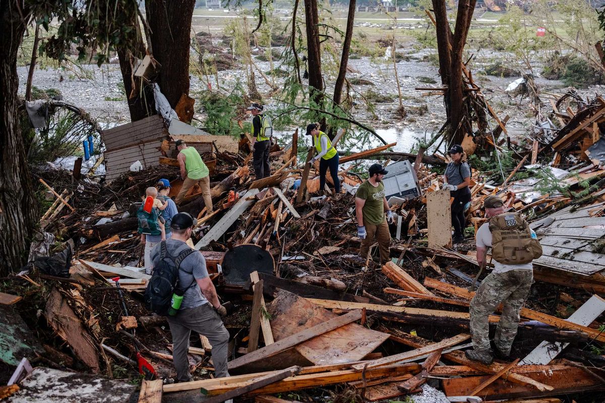 HUNT, TEXAS - JULY 6: Search and rescue workers dig through debris looking for any survivors or remains of people swept up in the flash flooding on July 6, 2025 in Hunt, Texas. Heavy rainfall caused flooding along the Guadalupe River in central Texas with multiple fatalities reported. (Photo by Jim Vondruska/Getty Images)