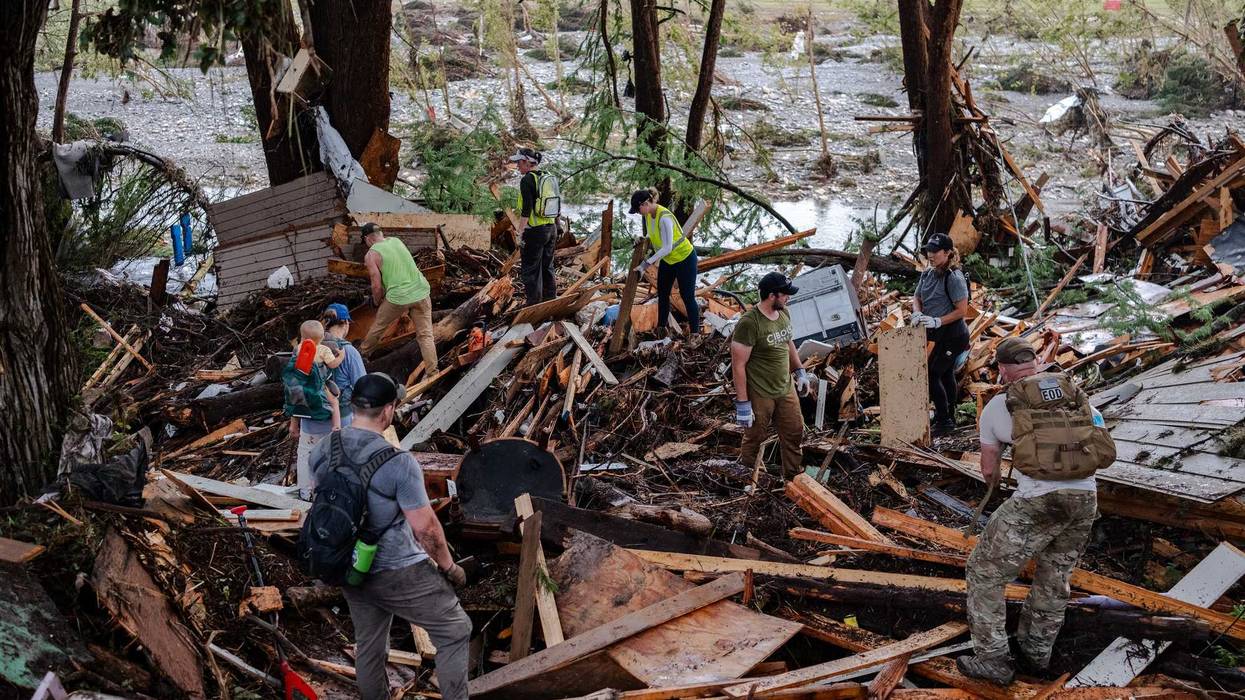 HUNT, TEXAS - JULY 6: Search and rescue workers dig through debris looking for any survivors or remains of people swept up in the flash flooding on July 6, 2025 in Hunt, Texas. Heavy rainfall caused flooding along the Guadalupe River in central Texas with multiple fatalities reported. (Photo by Jim Vondruska/Getty Images)