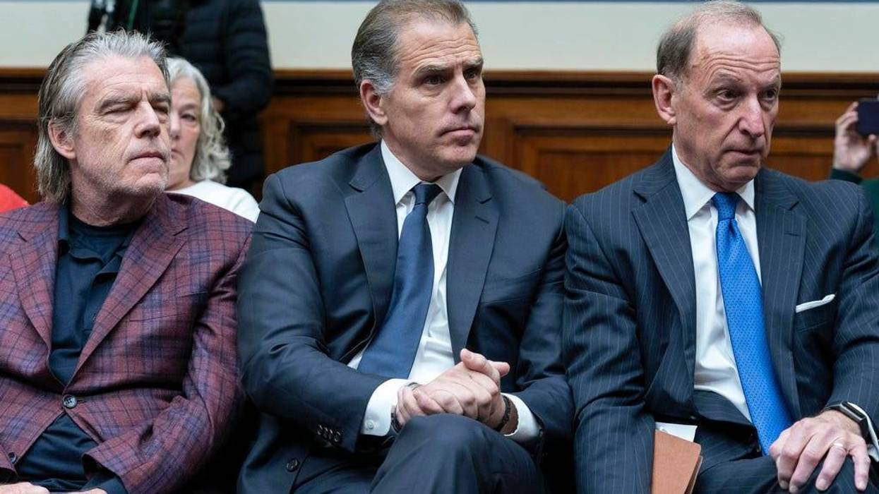 Hunter Biden, President Joe Biden's son, center, accompanied by his attorney Abbe Lowell, right, sit in the front row at a House Oversight Committee hearing as Republicans are taking the first step toward holding him in contempt of Congress, Wednesday, Jan. 10, 2024, on Capitol Hill in Washington.