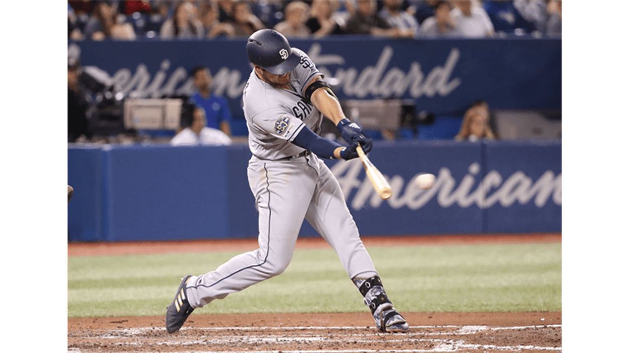 Hunter Renfroe #10 of the San Diego Padres hits a single in the fifth inning during MLB game action against the Toronto Blue Jays at Rogers Centre on May 25, 2019 in Toronto, Canada. (Photo by Tom Szczerbowski/Getty Images)