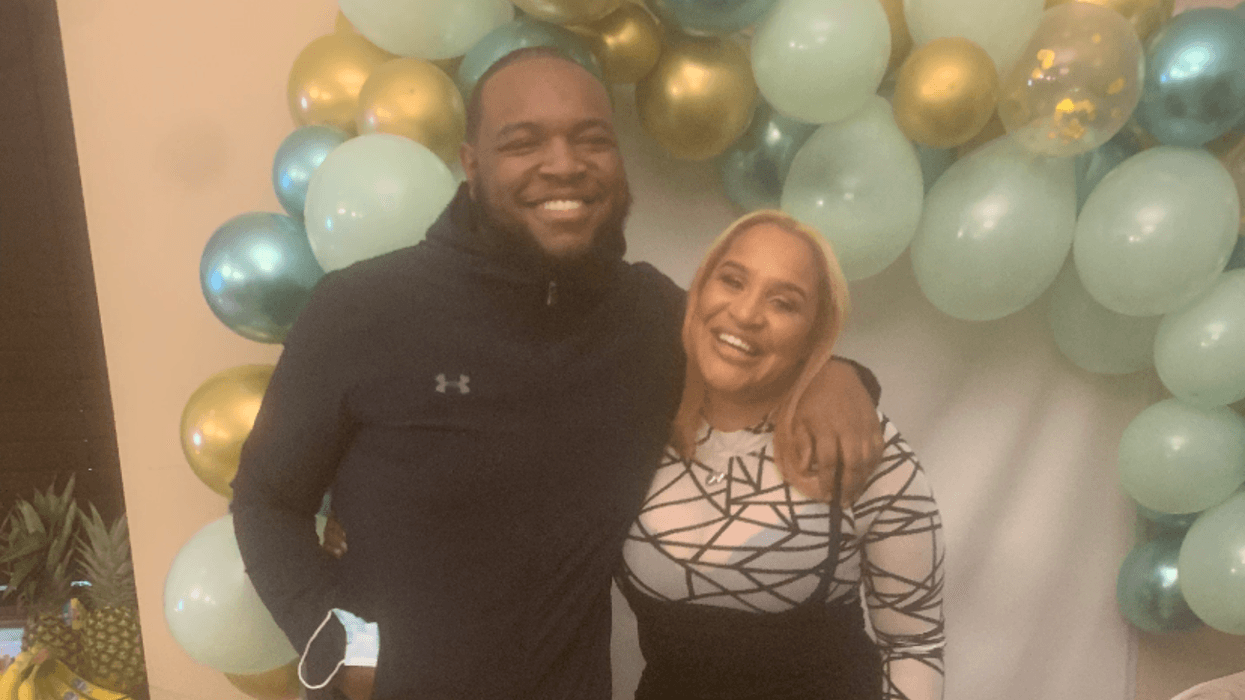 Hyram Hill (left) with a family member.