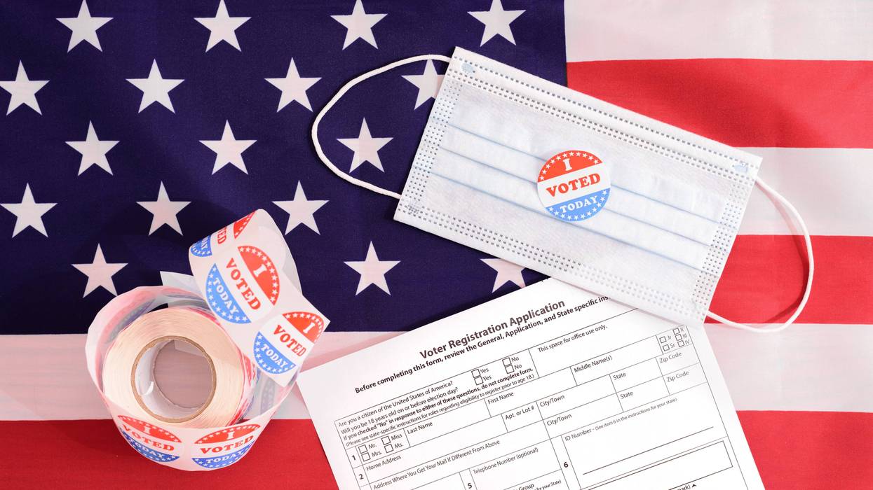 I Voted stickers, mask, voter registration application