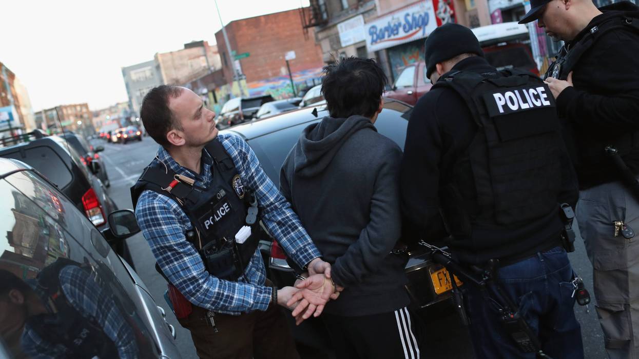 ICE agents arrest Mexican immigrants during a 2018 raid in New York City.