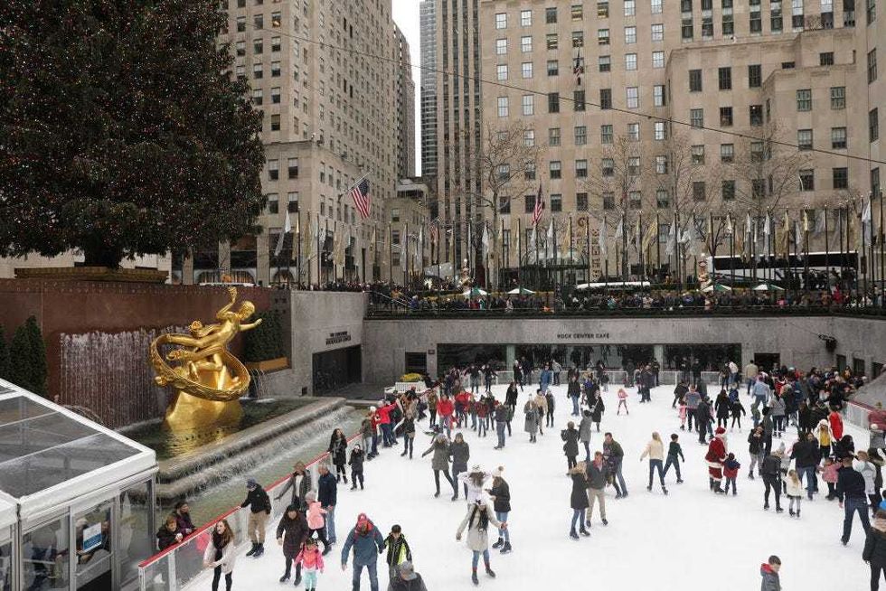 Ice skaters are joined by a man dressed as Santa Claus at The Rink at Rockefeller Center on December 14, 2018 in New York City. Rockefeller Center, home to the famous Christmas tree, is once again thronged with tourists, shoppers and holiday eleven days before Christmas.