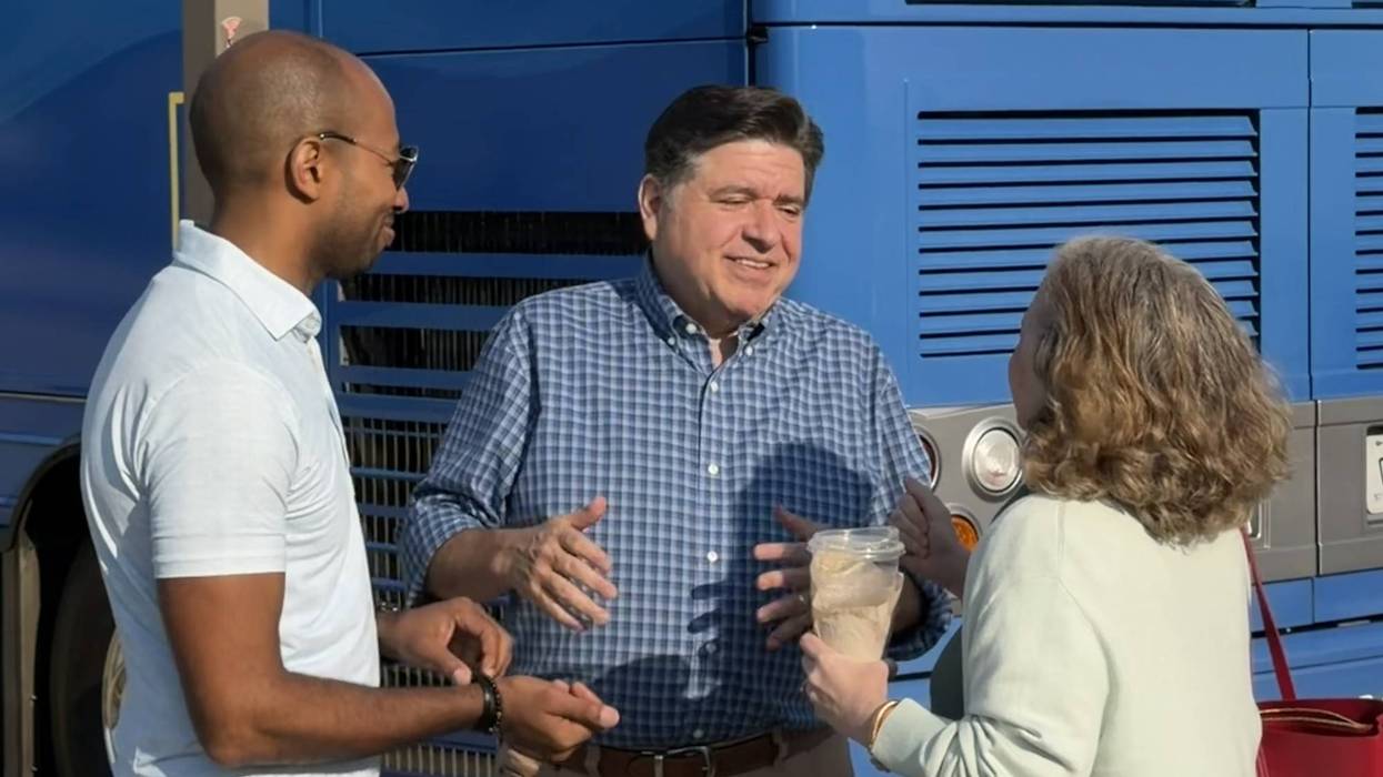 Illinois Gov. J.B. Pritzker and his lieutenant governor running mate Christian Mitchell (left) prepare to embark on their campaign bus tour from Chicago's Museum Campus, August 26, 2026.