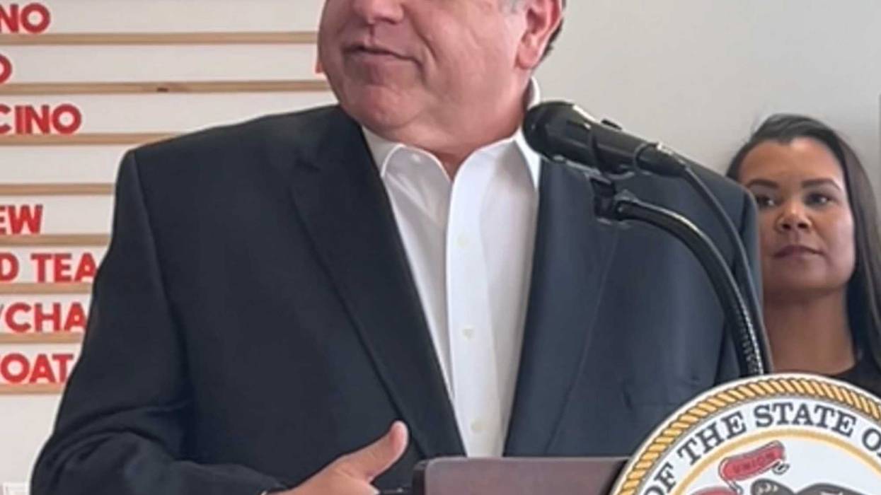 Illinois Gov. J.B. Pritzker talks to reporters in Skokie, November 21, 2025.