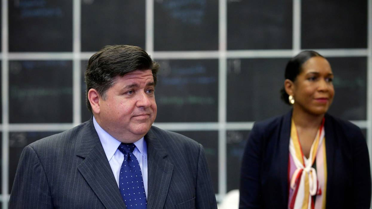Illinois Governor JB Pritzker stands with Illinois Lieutenant Governor Juliana Stratton