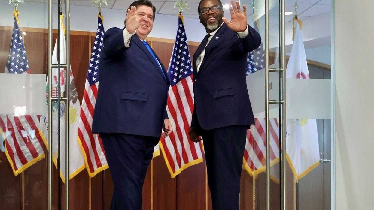 Illinois governor stands next to mayor-elect