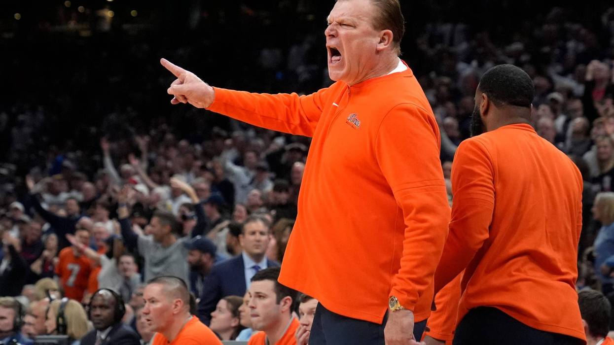 Illinois head coach Brad Underwood calls to officials during the first half of the Elite 8 college basketball game against UConn in the men's NCAA Tournament, Saturday, March 30, 2024, in Boston. (AP Photo/Steven Senne)