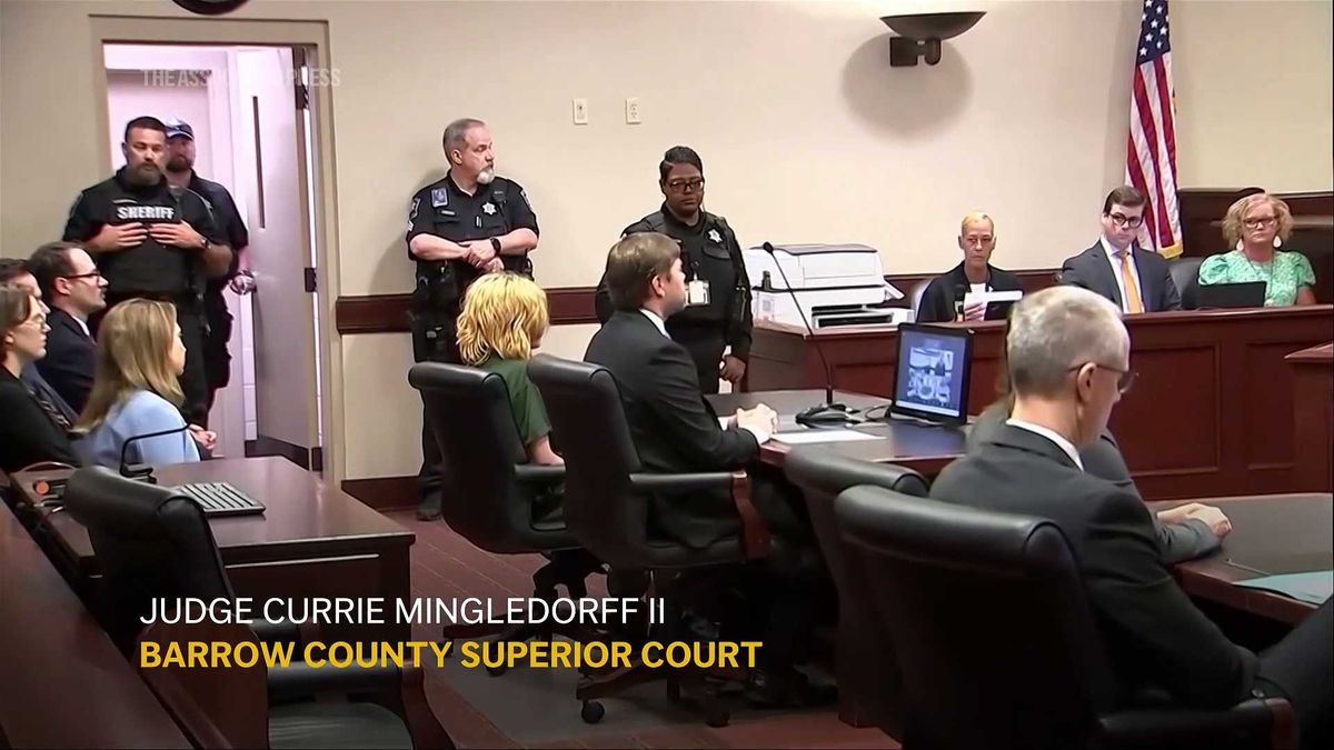 Father of 14-year-old school shooting suspect charged with murder: here's why