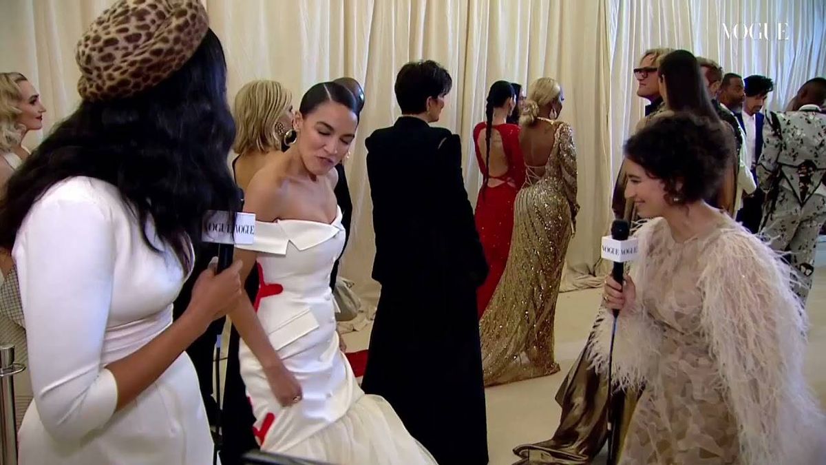 VIDEOS & PICS: AOC attends her first-ever Met Gala in 'Tax the Rich' gown