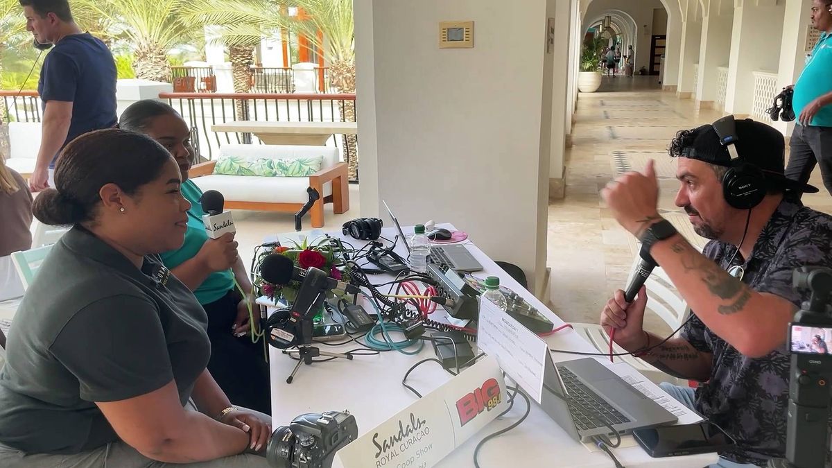 Coop chats with Josine Allee and Nathisha Mellens from the Curacao Tourist Board at Sandals Royal Curaçao