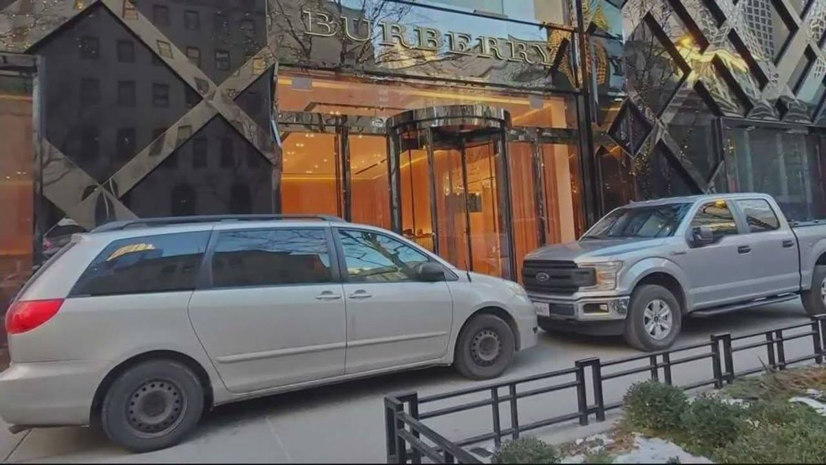 High-end Mag Mile retailer parks cars on sidewalk to prevent smash-and-grab burglaries
