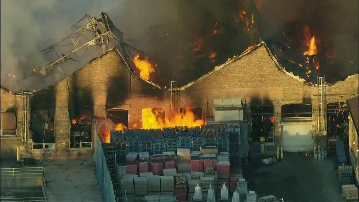 Massive fire at Chicago Heights furniture warehouse continues to burn