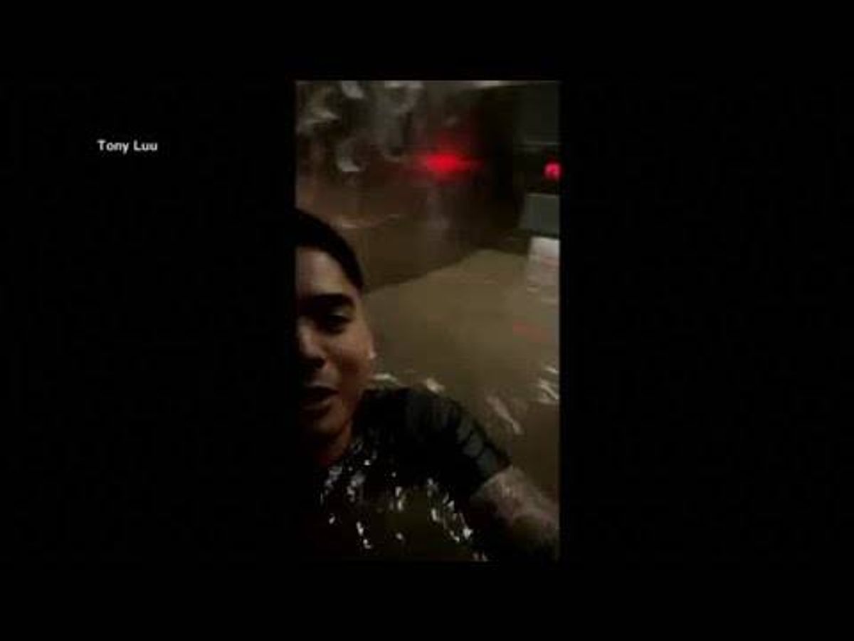 WATCH: The terrifying moment three people get trapped in a flooded elevator
