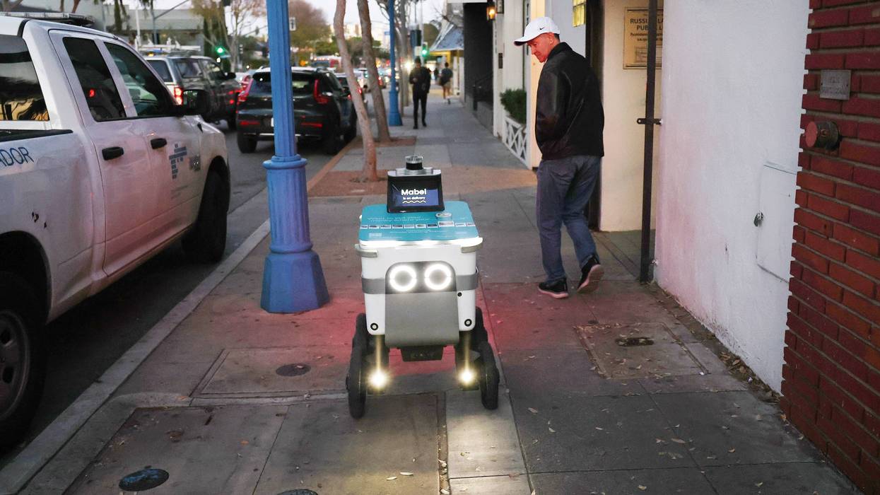 Delivery robot goes viral after shattering West Town bus shelter glass