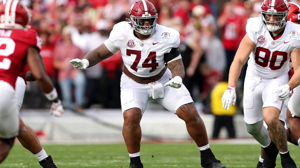 Smoke rising between Kadyn Proctor and Detroit Lions