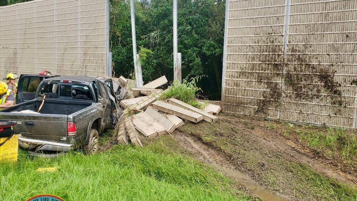 Driver hits wall, crushes truck, walks away