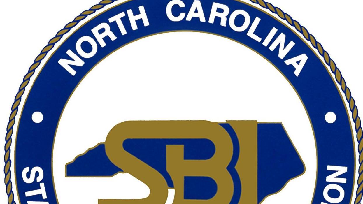 Three facing charges after man found dead in WNC home