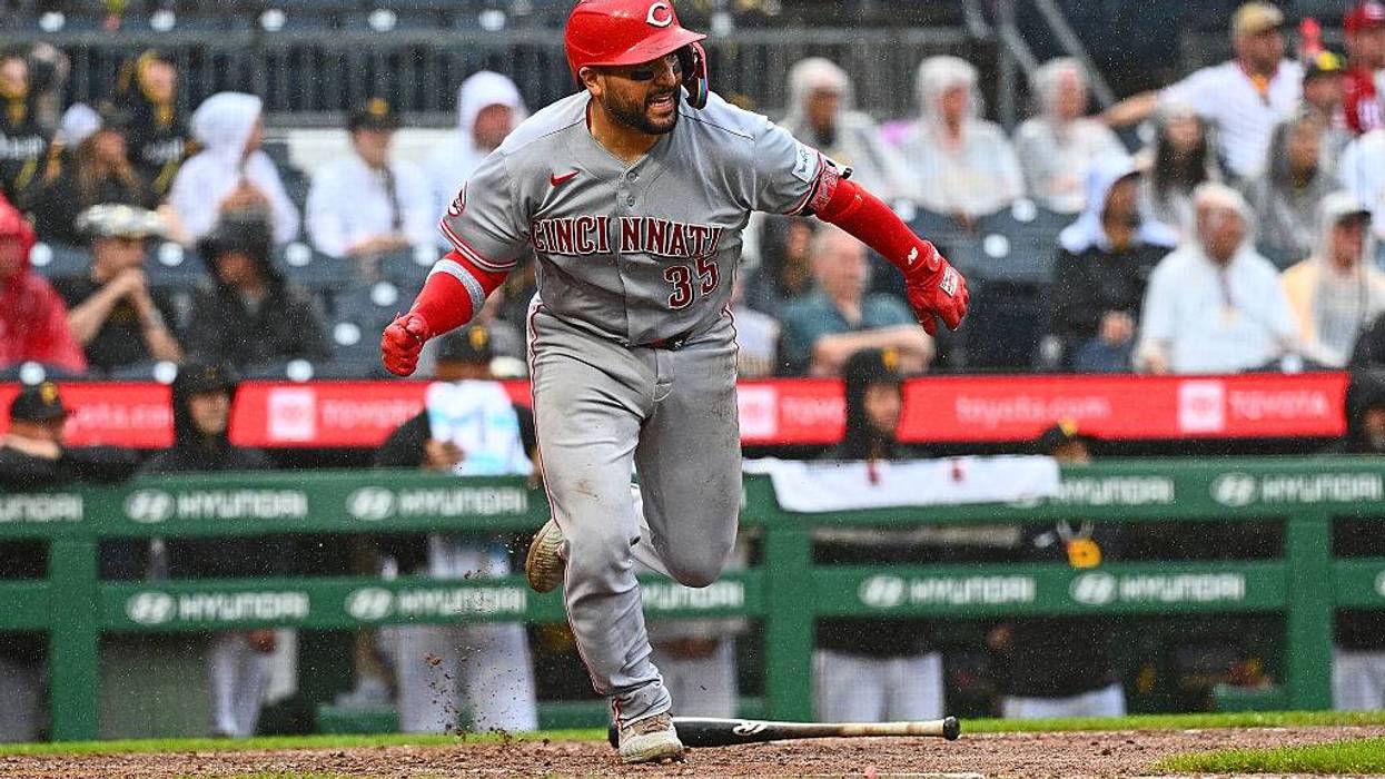 A strike from victory, Suarez hits 3-run HR in Reds win