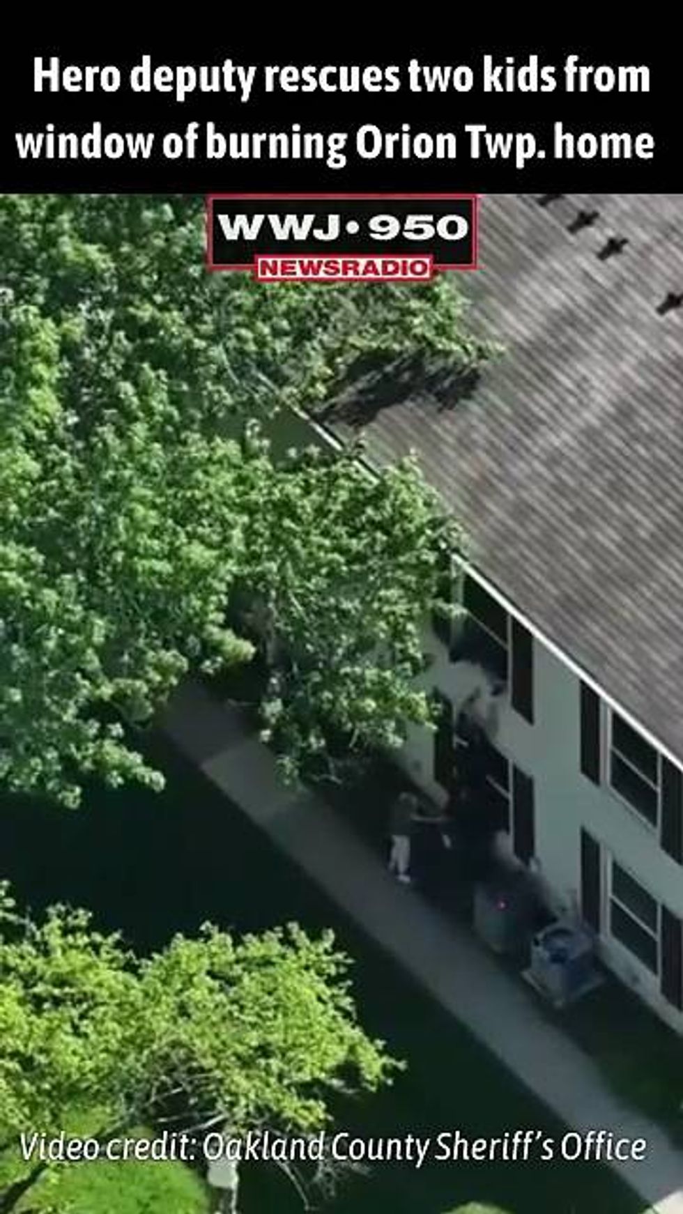 2 kids rescued from window of burning Oakland County home