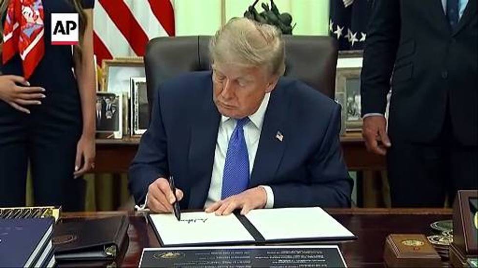 Trump signs executive order calling for spacing out childhood vaccine shots