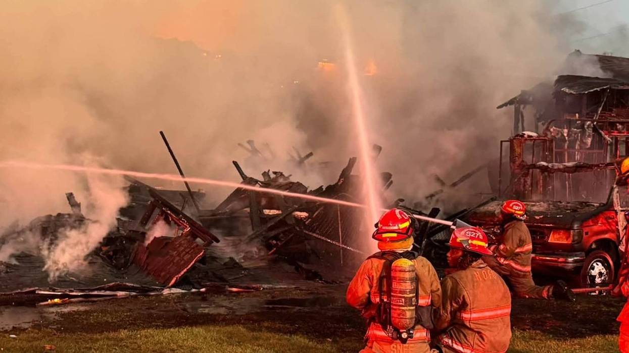 Fire burns through houses near Interstate 10 in New Orleans