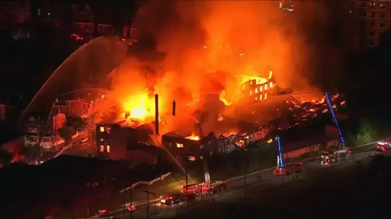 Massive fire engulfs Allentown warehouse and multiple row homes
