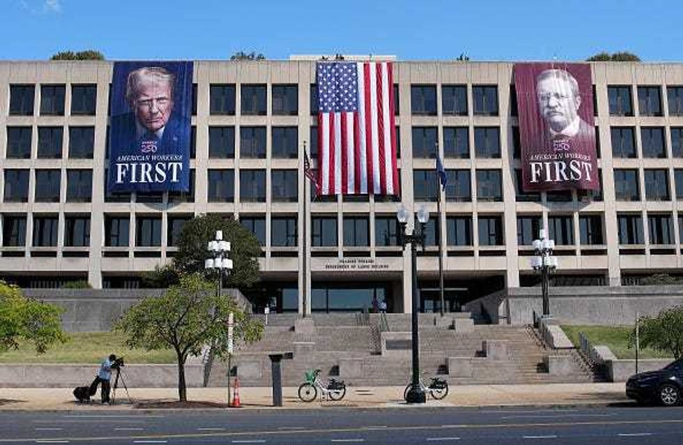 Images of U.S. President Donald Trump and former President Theodore Roosevelt are displayed on the side of the U.S. Department of Labor on August 25, 2025 in Washington, DC. The Trump administration has deployed federal officers and the National Guard to the District in order to place the DC Metropolitan Police Department under federal control and assist in crime prevention in the nation