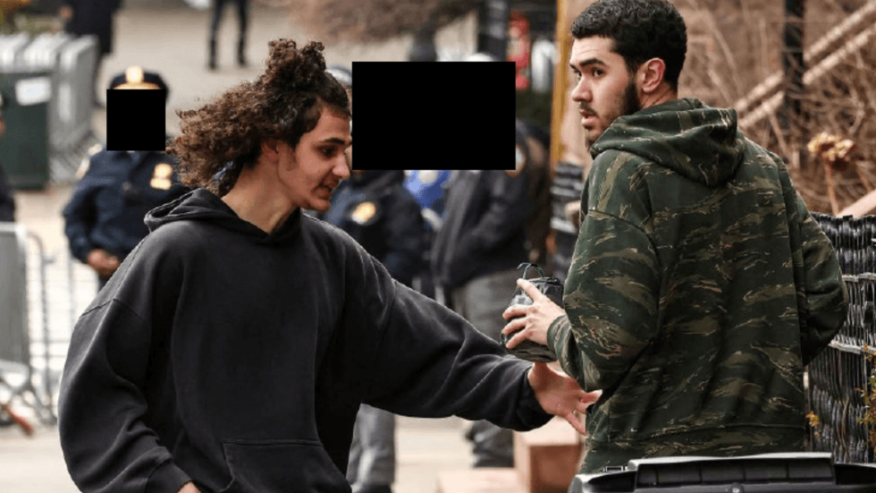 Immediately after throwing Device-1, Emir Balat ran to another location down the block and received a second explosive device ("Device-2") from Ibrahim Kayumi.