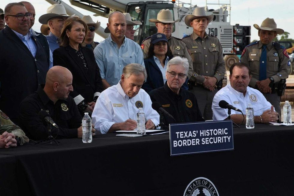 Texas governor signs bill that lets police arrest migrants who enter the US illegally