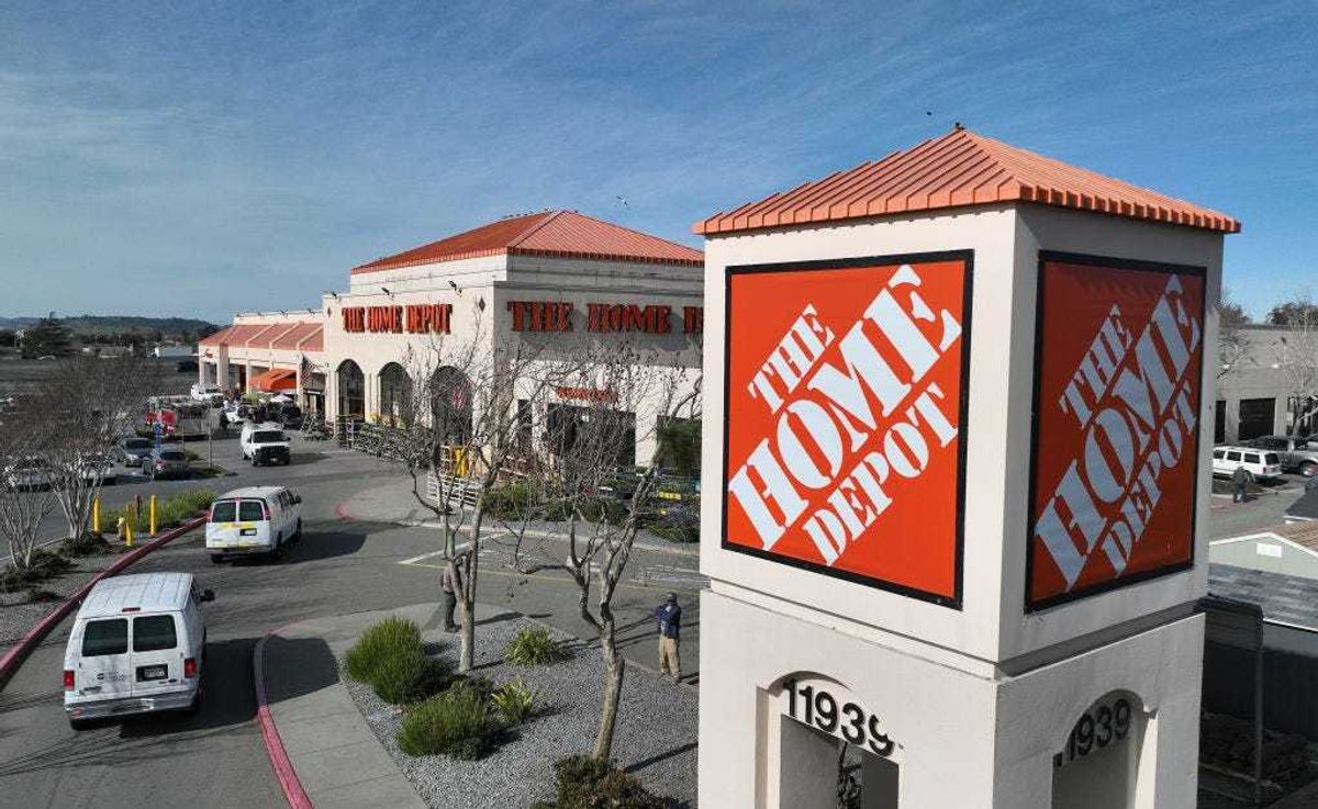In an aerial view, a sign is seen posted on the exterior of a Home Depot store on February 21, 2023 in El Cerrito, California.