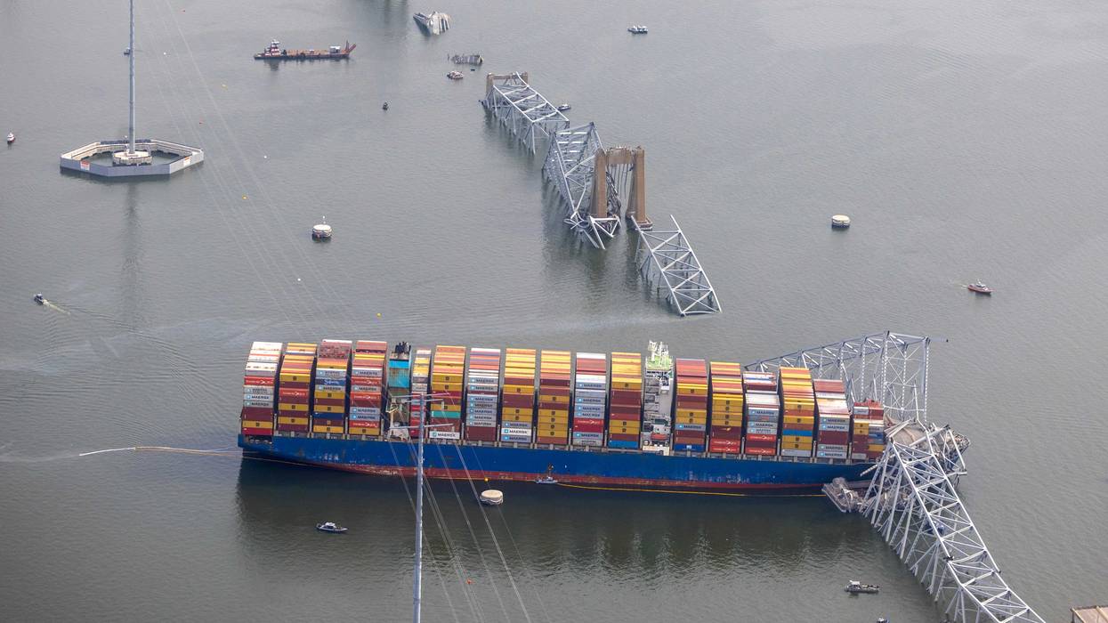 In an aerial view, cargo ship Dali is seen after running into and collapsing the Francis Scott Key Bridge on March 26, 2024 in Baltimore, Maryland