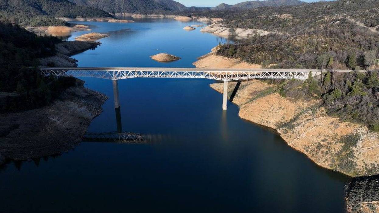In an aerial view, the Enterprise Bridge traverses Lake Oroville on February 14, 2023 in Oroville, California.